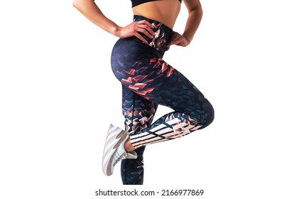 Closeup Of Fitness Woman With Fit Cheeks, Tight Hips And Firm Buttocks In Workout Leggins Isolated On White Background.