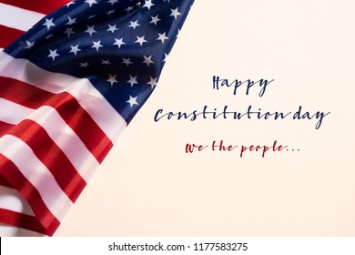 Closeup Of A Flag Of The United States And The Text Happy Constitution Day Against An Off-white Background