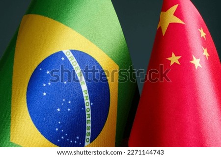 Close-up of the flags of Brazil and China.
