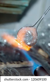 Closeup of a flame and melting glass piece