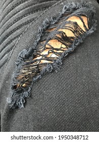 Closeup Of Flapped Ripped Jeans