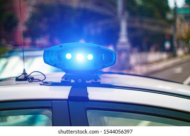 Close-up Of Flashing Lights On A Police Car.