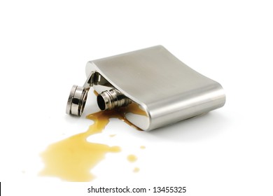 Close-up of a flask isolated on white and spill rum