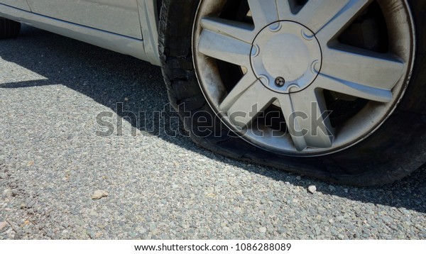 close-up of a flat tire\
car