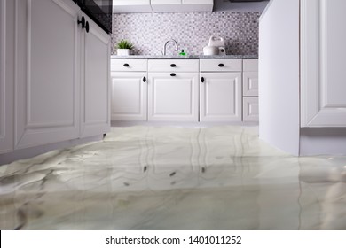 Close-up Of Flooded Floor In Kitchen From Water Leak