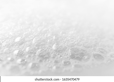 Close-up Foam Bubbles With Selective Focus From Soap, Shampoo Or Cleanser On White Background. Macro