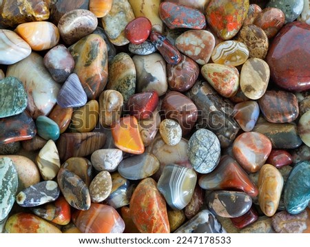 A Close-up Focus Stacked Image of a Variety of Tumbled Rocks to Include agates, Jasper, and Other Semi Precious Stones