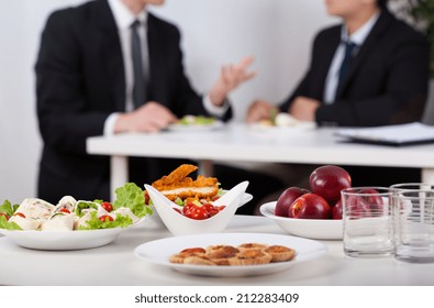 Close-up of a food and men during lunch break