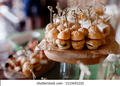 Close-up food for party: snacks, burgers, canapes. Catering service.