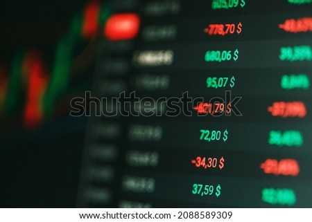 Close-up of Forex stock market price chart and tickers on digital screen. Soft focus, selective focus, blur