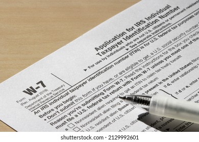 Closeup of Form W-7, Application for IRS Individual Taxpayer Identification Number (ITIN). Selective focus. - Shutterstock ID 2129992601