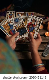 Close-up Of A Fortune Teller Reading Tarot Cards