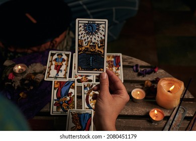 Close-up Of A Fortune Teller Reading Tarot Cards