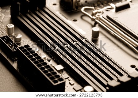 Close-up of four empty DDR5 DIMM slots on a modern computer motherboard. Concept of global semiconductor shortage and expensive electronic components. Photo