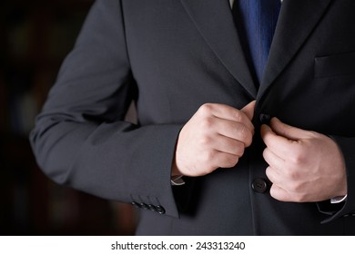 Close-up Fragment Of A Man In A Business Suit Unbottoning His Jacket, Shallow Depth Of Field Composition