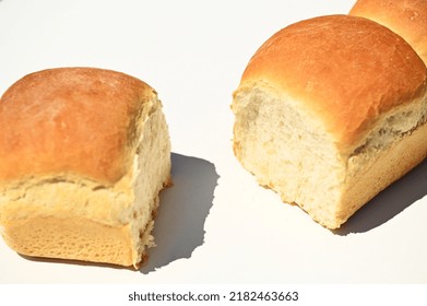 Close-up Of Fresh Baked Whole Grain Buns On A White Background With Copy Ad Space. Food Background. Still Life