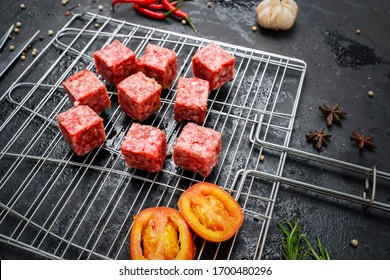 Closeup Of Fresh Beef Cube Steak On The Grill With Tomato