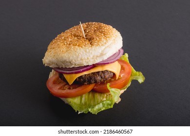 Close-up Of Fresh Burger Against Gray Background, Copy Space. Unaltered, Food, Snack, Fast Food, Studio Shot And Unhealthy Food Concept,