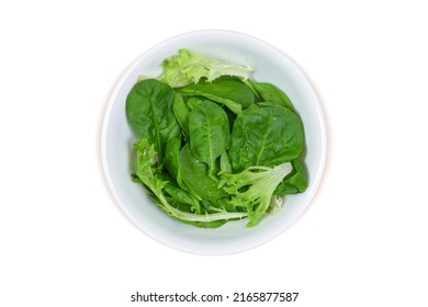 Closeup Of Fresh Green Spring Mix Lettuce. Includes Clipping Path Around The Bowl.