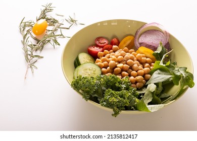 Close-up Of Fresh Healthy Food In Bowl By Herb On White Background, Copy Space. Unaltered, Food, Studio Shot, Healthy Eating, Organic.