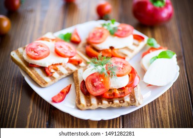 Closeup Of A Fresh Sandwich With Mozzarella, Tomatoes