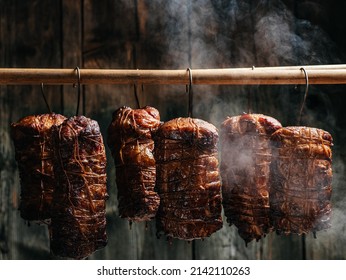Closeup of freshly smoked ham in smokehouse. Natural product from an organic farm. banner, menu, recipe place for text.