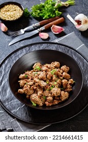 Close-up Of Fried Italian Sausage Of Freshly Ground Pork Meat And Spices In Black Bowl On Concrete Table, Vertical View Form Above