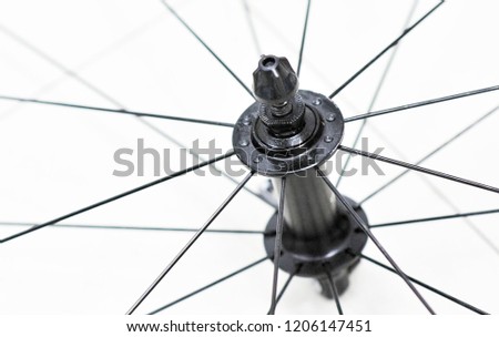 Closeup of front bicycle wheel, hub and spokes of road bike