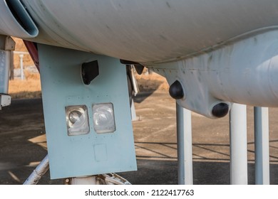 Closeup Of Front Landing Lights, Part Of Landing Gear Bay Door Of Military Aircraft On Display In Public Park.