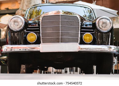 Close-up of the front part of black vintage car. Exhibition. Headlights and details. - Shutterstock ID 754540372