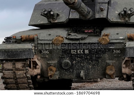 close-up front profile view of a British Army Challenger 2 FV4034 Main Battle Tank in action on a military exercise, Wiltshire UK