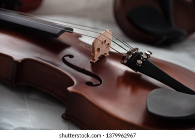 Closeup front side of violin,In selective focus at Fine Tuners,part of the instrument,classic style,vintage and art tone,blurry light around