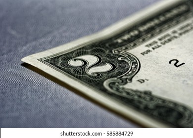 Closeup of the front of a two dollar bill.