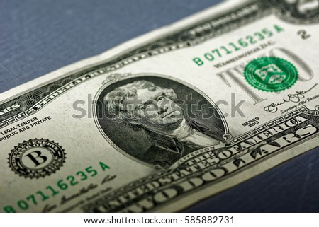 Closeup of the front of a two dollar bill.