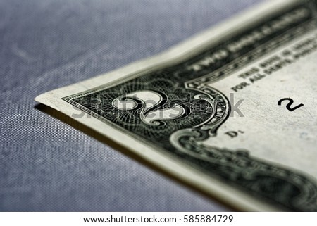 Closeup of the front of a two dollar bill.