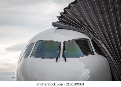 Close-up Front View Of The Cockpit Of A Passenger Airplane At The Air Bridge