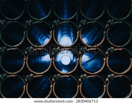 Close-Up Front View of Empty Multiple Rocket Launcher Tubes with Blue Reflections
