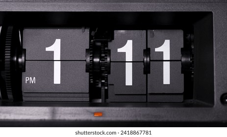 Close-up Front view Flip clock tells time 01.11 PM. - Powered by Shutterstock