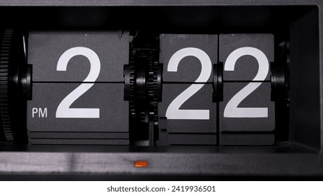 Close-up Front view Flip clock tells time 02.22 PM. - Powered by Shutterstock