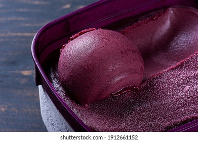 Close-up Of Frozen Brazilian Açaí In A Purple Box. Fruit Of Amazon (Acai). Top View