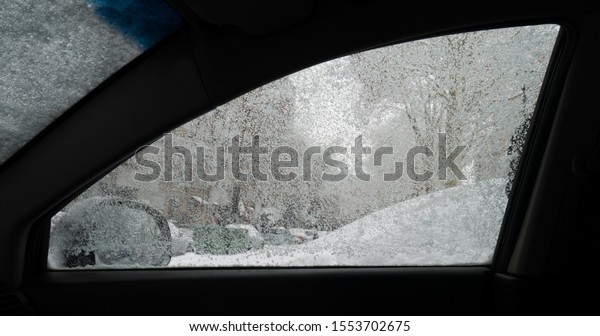 Closeup\
of frozen car window - view from inside the\
car.