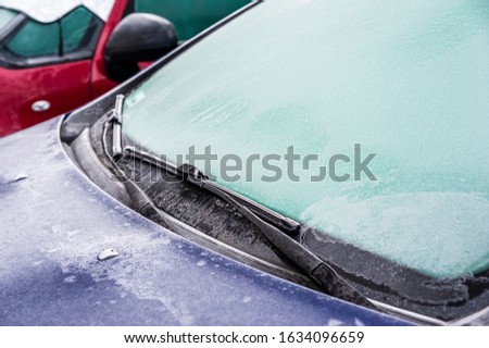 Closeup of frozen car windshield on a cold winter day