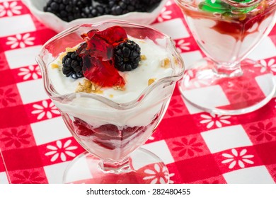 Closeup Of Fruit Parfait With Greek Yogurt And Mint And Strawberry Jello.