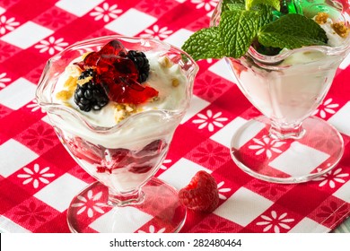 Closeup Of Fruit Parfait With Greek Yogurt And Mint And Strawberry Jello.