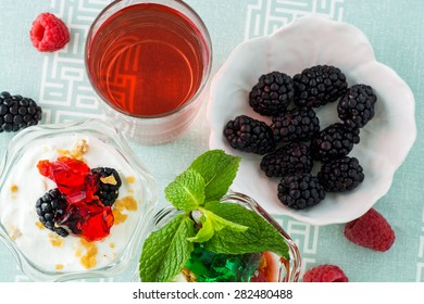 Closeup Of Fruit Parfait With Greek Yogurt And Mint And Strawberry Jello.