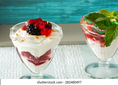 Closeup Of Fruit Parfait With Greek Yogurt And Mint And Strawberry  Jello.