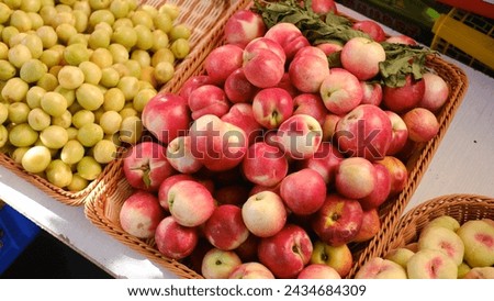 Closeup of fruit stall with peaches and apricots in Xinjiang street in China, Asia. 