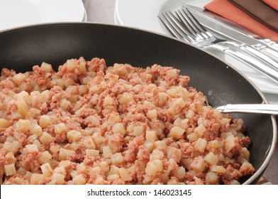 Closeup of a frying pan full of corned beef hash