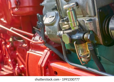 Closeup Of Fuel Filter With Transparent Under Cup On Old Red Restored Tractor. Image With Selective Focus.      