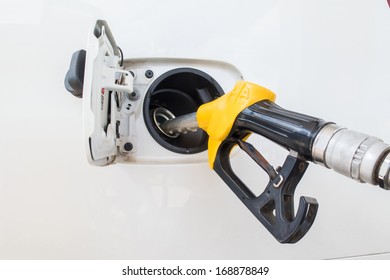 Close-up Fuel Nozzle. Fill Up Fuel At Gas Station.